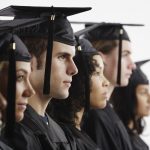 Graduates in Cap and Gown --- Image by © Royalty-Free/Corbis